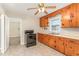 Cozy kitchen featuring wooden cabinets, laminate countertops, and a black gas range at 1209 Bobbitt Dr, Garner, NC 27529