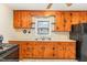 Close-up view of the kitchen with wooden cabinets and countertops at 1209 Bobbitt Dr, Garner, NC 27529