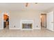 Open living area featuring a decorative fireplace and entry to other rooms at 1209 Bobbitt Dr, Garner, NC 27529