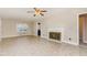 Inviting living room with fireplace, ceiling fan, and large windows at 1209 Bobbitt Dr, Garner, NC 27529