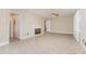 Spacious living room with neutral tones, fireplace, and ample lighting at 1209 Bobbitt Dr, Garner, NC 27529