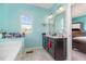 Bright bathroom featuring a dual sink vanity, and tile flooring at 1217 Trilogy Blvd # 174, Morrisville, NC 27560