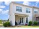 View of the home's back exterior and patio space, with views of the backyard and neighborhood at 1217 Trilogy Blvd # 174, Morrisville, NC 27560