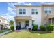 View of the home's back exterior and patio space, showing a well-maintained lawn at 1217 Trilogy Blvd # 174, Morrisville, NC 27560