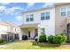 Exterior of the home showcasing the back of the property and patio with a grassy lawn at 1217 Trilogy Blvd # 174, Morrisville, NC 27560
