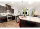 Bright kitchen featuring an island with stainless steel appliances and an open concept design at 1217 Trilogy Blvd # 174, Morrisville, NC 27560