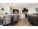 Open-concept eat-in kitchen, dining area, hardwood floors and an island with seating at 1217 Trilogy Blvd # 174, Morrisville, NC 27560