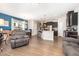 Open-concept living space with an eat-in kitchen, dining area, hardwood floors and an island with seating at 1217 Trilogy Blvd # 174, Morrisville, NC 27560