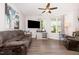 Spacious living room features a ceiling fan, a flat screen television and an attached dining area at 1217 Trilogy Blvd # 174, Morrisville, NC 27560
