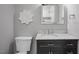 Bathroom features a dark vanity, marble countertop, updated tile and new toilet at 123 Becket Bend Bnd, Pittsboro, NC 27312