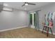 Bedroom features hardwood floors, modern fan and natural light from a french door at 123 Becket Bend Bnd, Pittsboro, NC 27312