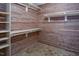 Walk-in cedar closet features hardwood walls, floor and custom shelving at 123 Becket Bend Bnd, Pittsboro, NC 27312