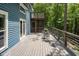 Outdoor deck space with chairs and table to enjoy forest views at 123 Becket Bend Bnd, Pittsboro, NC 27312
