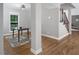 Open dining area featuring hardwood floors and view from window, adjacent to the staircase at 123 Becket Bend Bnd, Pittsboro, NC 27312