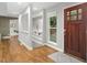 Entryway features an updated front door, hardwood floors and recessed shelving at 123 Becket Bend Bnd, Pittsboro, NC 27312