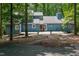 Charming two-story home with unique architectural details and a pathway leading to the inviting front entrance at 123 Becket Bend Bnd, Pittsboro, NC 27312