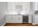Kitchen featuring white cabinets, wine refrigerator, granite countertops and marble backsplash at 123 Becket Bend Bnd, Pittsboro, NC 27312