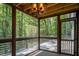 Enclosed screen porch with chandelier and view of the backyard at 123 Becket Bend Bnd, Pittsboro, NC 27312