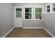 Bright sun room features tile floor, large windows and updated light fixtures at 123 Becket Bend Bnd, Pittsboro, NC 27312