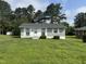 Charming single story home with manicured lawn and mature trees at 124 Kearney Ave, Oxford, NC 27565