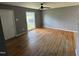An empty living room with hardwood floors and a ceiling fan at 124 Kearney Ave, Oxford, NC 27565