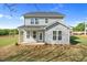 The home's backyard features a covered patio and grassy backyard with trees in the distance at 1305 Westerland Way # 17, Durham, NC 27703