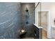 Sleek bathroom showcases luxurious black tile, a glass-enclosed shower, and modern fixtures at 1305 Westerland Way # 17, Durham, NC 27703