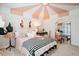 Parisian bedroom features fashion inspired decor, pink and white color scheme and black and white striped throw blanket at 1305 Westerland Way # 17, Durham, NC 27703