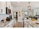 Elegant kitchen flowing into a living area, showcasing granite countertops and a stylish design at 1305 Westerland Way # 17, Durham, NC 27703