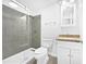 The renovated bathroom has a shower with a glass door, and a single sink vanity at 1311 Meadow Ln, Chapel Hill, NC 27516