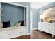 Cozy bedroom sitting area with a built-in bench, drawers, and decorative pillows at 1416 Bramble Dr, Durham, NC 27712