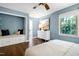Charming bedroom sitting area with natural light, a view to the en suite, and white dresser at 1416 Bramble Dr, Durham, NC 27712
