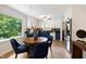 Cozy dining area featuring a wood table, stylish chairs, and natural light at 1416 Bramble Dr, Durham, NC 27712