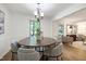 Elegant dining area adjacent to the living room, featuring modern lighting and comfortable seating for Gathering gatherings at 1416 Bramble Dr, Durham, NC 27712