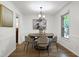 Bright dining room with a round table and stylish chairs, creating an elegant and inviting space for meals at 1416 Bramble Dr, Durham, NC 27712