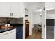 View of the updated kitchen with breakfast bar, stainless steel refrigerator and cozy breakfast area at 1416 Bramble Dr, Durham, NC 27712