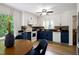 Updated kitchen featuring two-tone cabinets, a mosaic tile backsplash, and a sunlit breakfast nook at 1416 Bramble Dr, Durham, NC 27712