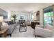 Open-concept living room boasts neutral tones and stylish furnishings with views to the dining area, creating a welcoming space at 1416 Bramble Dr, Durham, NC 27712