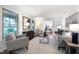 Bright living room featuring ample seating, soft carpet, and large windows, creating a cozy and inviting atmosphere at 1416 Bramble Dr, Durham, NC 27712