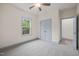 A neutral bedroom with plush carpeting, with natural light coming from a window and closet access at 147 Harmony Trl, Broadway, NC 27505