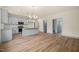 Open layout featuring a gray kitchen with granite countertops, stainless appliances, and modern fixtures at 147 Harmony Trl, Broadway, NC 27505