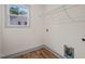 Bright laundry room featuring laminate floors and a wire rack at 147 Harmony Trl, Broadway, NC 27505
