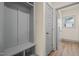 A mudroom with a built-in storage unit and access to an exterior door at 147 Harmony Trl, Broadway, NC 27505