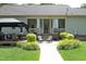 View of the back porch and lush backyard, ideal for entertaining or enjoying the outdoors with views of the lawn at 150 Churchill Rd, Louisburg, NC 27549
