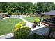 This property has an expansive backyard featuring a well-manicured lawn, in-ground pool and a charming gazebo at 150 Churchill Rd, Louisburg, NC 27549