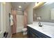 Traditional bathroom featuring tub, shower, and gray vanity with marble countertop at 150 Churchill Rd, Louisburg, NC 27549