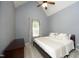 Inviting bedroom with plush carpeting, ceiling fan, and natural light at 150 Churchill Rd, Louisburg, NC 27549