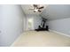 Workout area offering carpet, ceiling fan, natural light and exercise machine at 150 Churchill Rd, Louisburg, NC 27549
