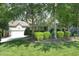 A beautifully landscaped front yard with lush greenery frames this charming home at 150 Churchill Rd, Louisburg, NC 27549