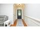 Elegant foyer with hardwood floors, detailed trim, and a stylish front door creates a welcoming entrance at 150 Churchill Rd, Louisburg, NC 27549